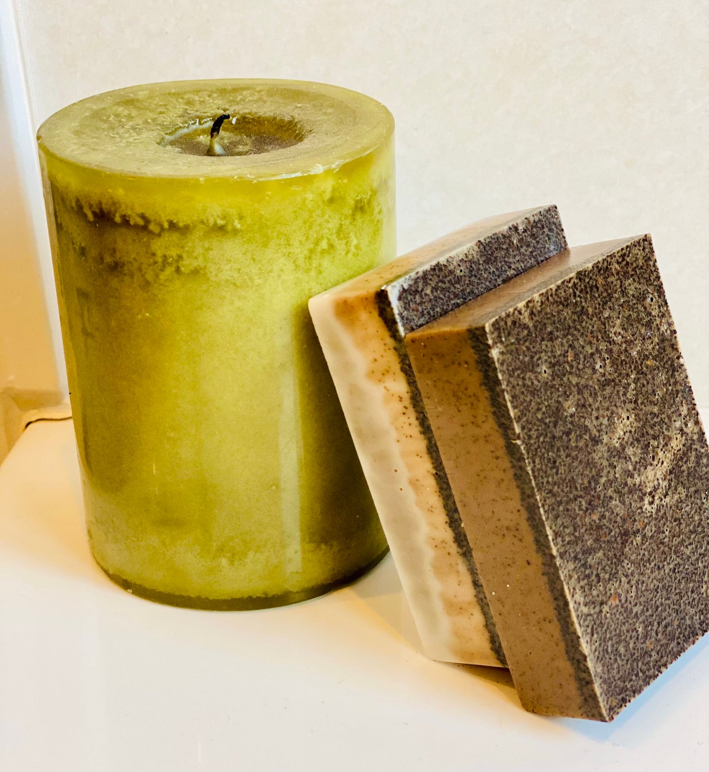 Organic Coconut Milk Coffee Soap Bars stacked on a candle