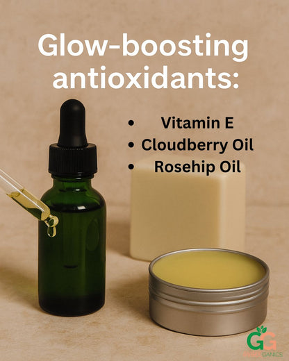 Bottle of GingerGanics Glow Drops Serum with glow-boosting antioxidants: vitamin E, Cloudberry Oil, Rosehip Oil listed next to the tin of healing balm and handmade soap
